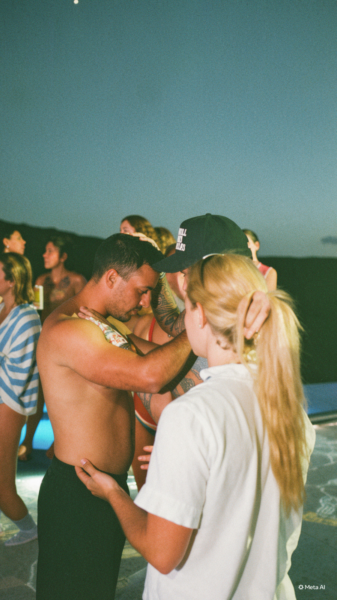 Guests praying together poolside at night at a Sunday S'mores house party